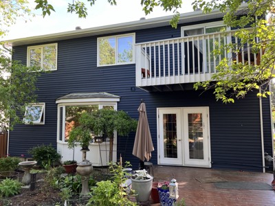 Navy blue painted exterior with crisp white trim and shutters
